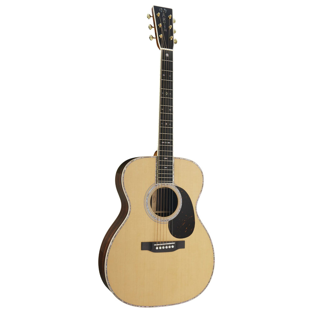 Martin 00042 Standard Series auditorium acoustic guitar with a rich wood finish and six strings, shown from a front angle.
