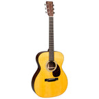Martin OM21 Standard Series auditorium acoustic guitar with a rich wood finish and steel strings, shown from a front angle.