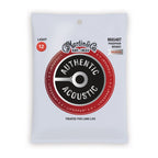 Martin Authentic Treated Light 12-54 phosphor bronze acoustic guitar strings on a guitar, showcasing the string packaging.