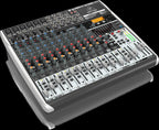 Behringer Xenyx QX1832USB analogue mixer with multiple channels, knobs, and USB port for audio mixing and recording.
