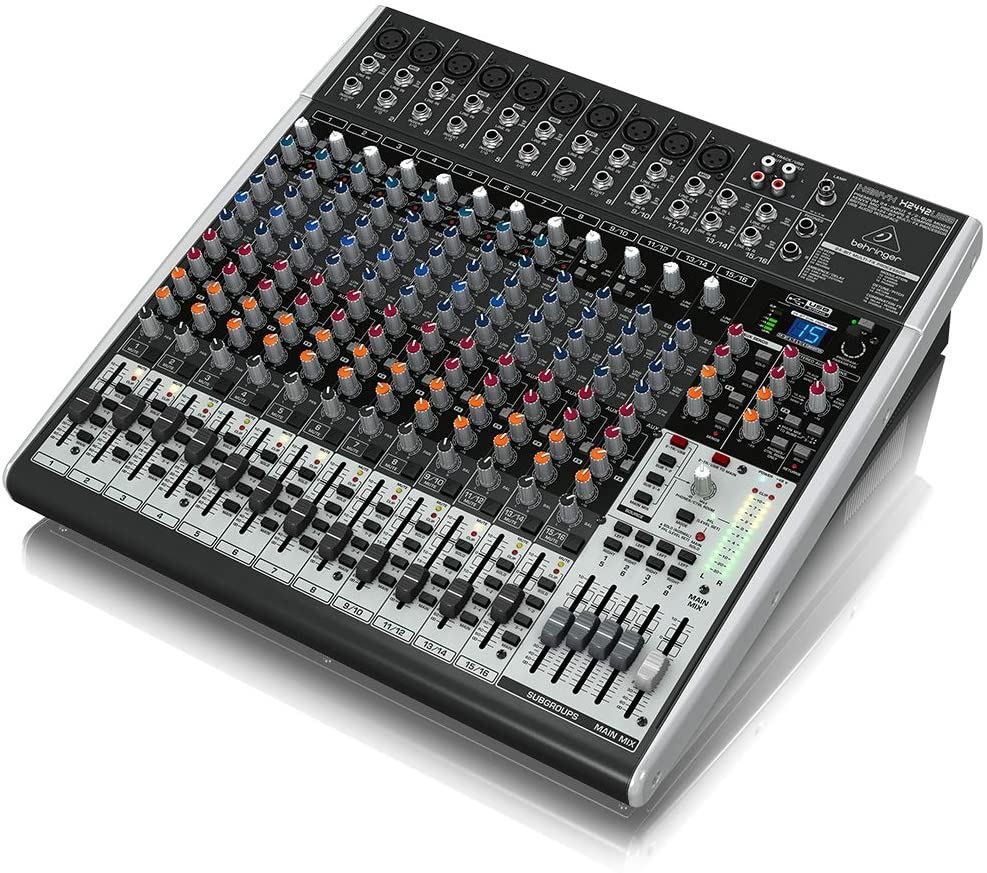 Behringer Xenyx X2442USB analogue mixer with multiple channels, knobs, and inputs for professional audio mixing.