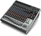 Behringer Xenyx X2442USB analogue mixer with multiple channels, knobs, and inputs for professional audio mixing.