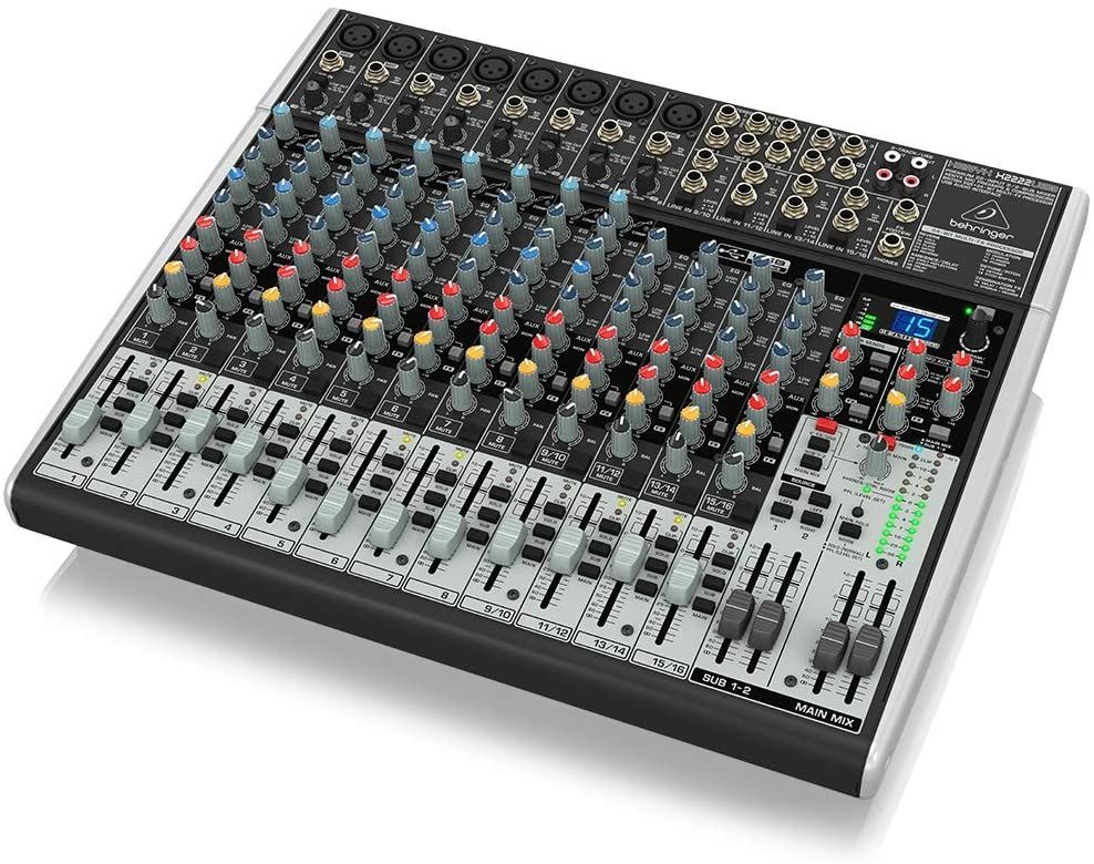 Behringer Xenyx X2222USB analogue mixer with multiple input channels, knobs, and USB connectivity for audio mixing.