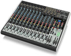 Behringer Xenyx X2222USB analogue mixer with multiple input channels, knobs, and USB connectivity for audio mixing.