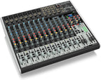 Behringer Xenyx X2222USB analogue mixer with multiple input channels, knobs, and USB connection for audio mixing and recording.