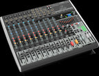 Behringer Xenyx X1832USB analogue mixer with multiple input channels, knobs, and USB connectivity for audio mixing.