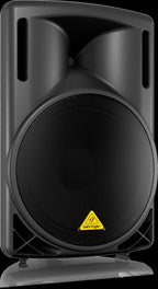 Behringer Eurolive B215D powered speaker showing a black loudspeaker with control panel and sturdy stand mount.