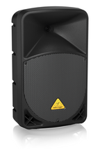 Behringer Eurolive B112D 12-inch powered PA speaker with 1000 watt output, showing front view with controls and grille.