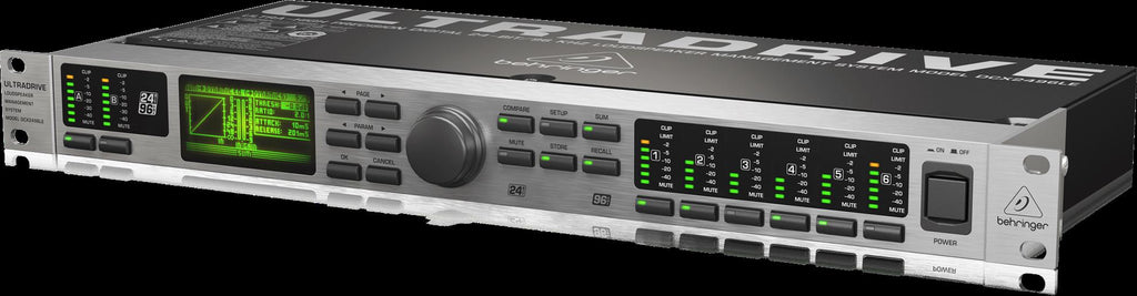 Behringer Ultradrive DCX2496LE studio outboard processor with control knobs and display, used for audio processing and sound management.