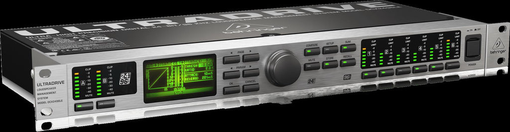 Behringer Ultradrive DCX2496LE studio outboard processor with control knobs and display screen on a professional audio equipment rack