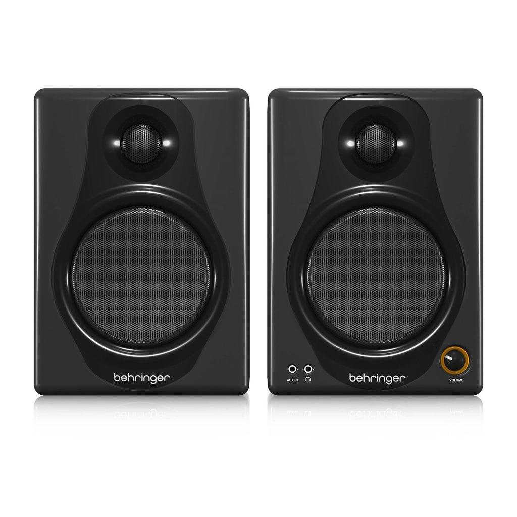 Pair of Behringer Media 40USB 4-inch studio monitor speakers showcasing black cabinets and front-facing drivers.