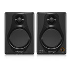 Pair of Behringer Media 40USB 4-inch studio monitor speakers showcasing black cabinets and front-facing drivers.