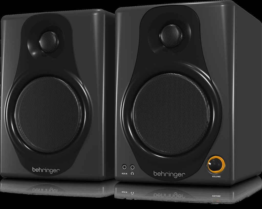 Behringer Media 40USB 4-inch studio monitor speakers pair, showing sleek black design and front speaker grills.