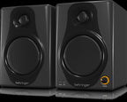 Behringer Media 40USB 4-inch studio monitor speakers pair, showing sleek black design and front speaker grills.