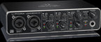 Behringer U-Phoria UMC204HD USB audio interface with dual inputs and knobs for sound control.