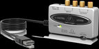 Behringer U-Control UCA202 USB audio interface with input and output jacks, compact design, and control knobs for audio recording.