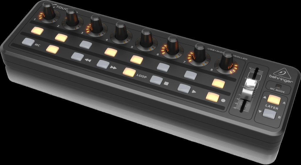 Behringer X-Touch Mini USB MIDI controller with knobs and buttons for music production and digital audio control.