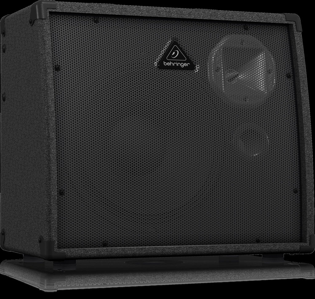 Behringer K900FX Ultratone Keyboard Amp with multiple inputs and speaker grille visible in a studio setting.