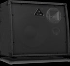 Behringer K900FX Ultratone Keyboard Amp with multiple inputs and speaker grille visible in a studio setting.