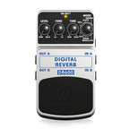 Behringer DR600 Digital Reverb Effects Pedal showing controls and input/output jacks on a tabletop.
