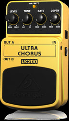Behringer UC200 Ultra Chorus effects pedal with control knobs and input/output jacks on a pedalboard.