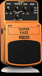 Behringer SF300 Super Fuzz effects pedal showing a compact guitar effects pedal with control knobs and input/output jacks.