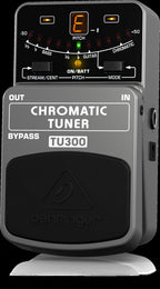 Behringer TU300 chromatic tuner pedal with LED display and control knobs for accurate guitar and bass tuning.