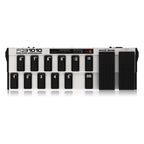 Behringer FCB1010 MIDI foot controller with dual footswitches and expression pedals for keyboard and MIDI setup.