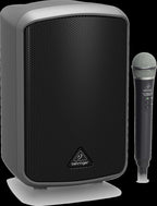 Behringer Europort MPA100BT package PA system with 100w speaker and microphone in a home setting.