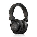 Behringer HC200 DJ studio headphones with closed-back design, over-ear construction, and adjustable headband for professional audio monitoring.