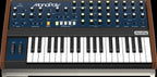 Behringer Monopoly analog polyphonic synthesizer keyboard with vintage-style controls and colorful patch panel.