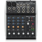 Behringer XENYX 802S analog 8-channel mixer with USB streaming interface, featuring knobs and input ports.