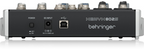 Behringer XENYX 802S analog 8-channel mixer with USB streaming interface, featuring knobs and input ports on a black control surface.