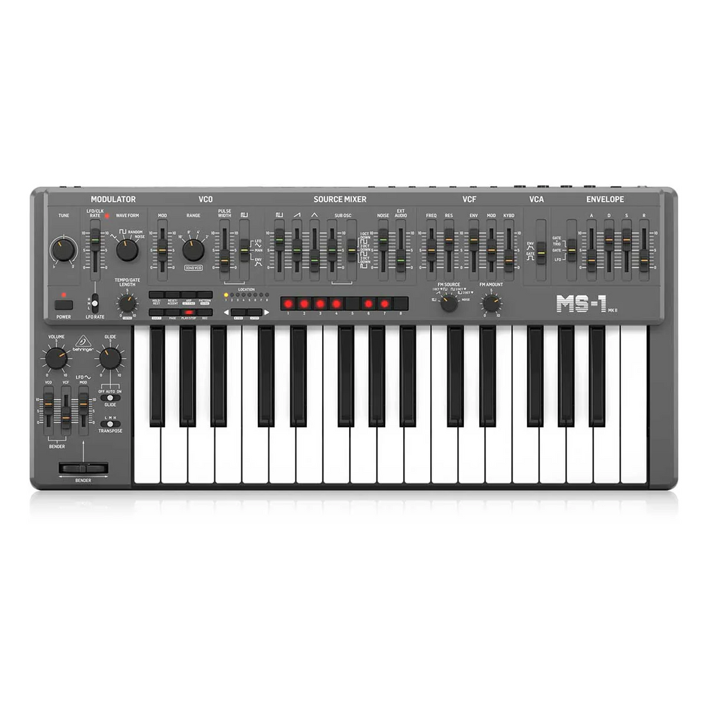 Behringer MS-1 MK II-GY analog synthesizer keyboard with knobs, buttons, and a sleek gray design, on a wooden surface.