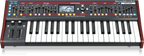 Behringer Deepmind 6X true analog 6-voice polyphonic synthesizer keyboard with knobs and keys, close-up view.
