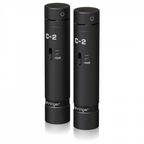 Behringer C2 Dark Edition condenser studio microphones in a matched pair, featuring professional-grade design and dual capsule technology.