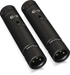 Behringer C2 Dark Edition condenser studio microphones in a matched pair, shown with their sleek black finish and professional design.