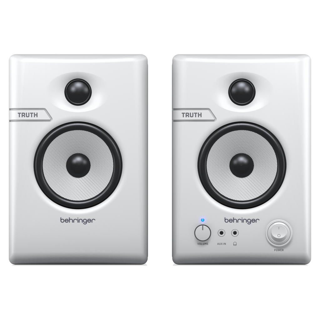 Pair of Behringer Truth 3.5 studio monitor speakers in white with Bluetooth connectivity, designed for accurate sound reproduction.