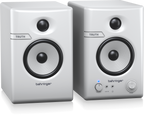 Pair of Behringer Truth 3.5 studio monitor speakers in white with Bluetooth connectivity, showing their front view.