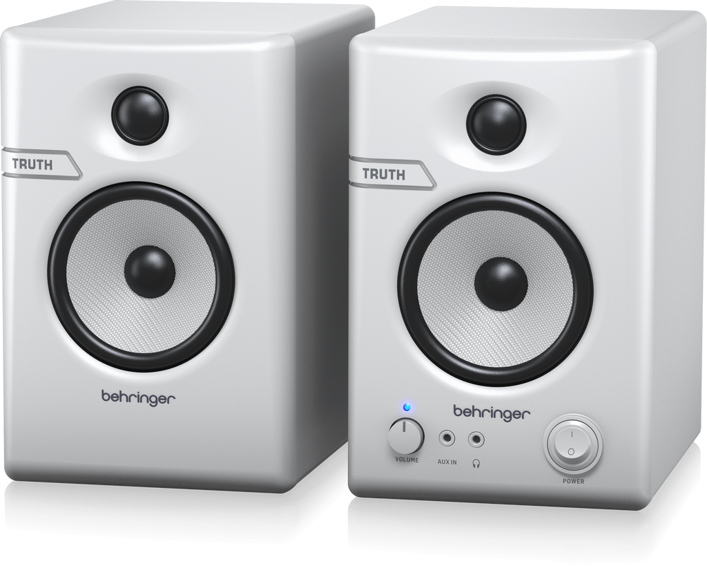 Pair of Behringer Truth 3.5 studio monitor speakers in white with Bluetooth connectivity, showing the front view of the speakers.