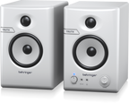 Pair of Behringer Truth 3.5 studio monitor speakers in white with Bluetooth connectivity, showing the front view of the speakers.