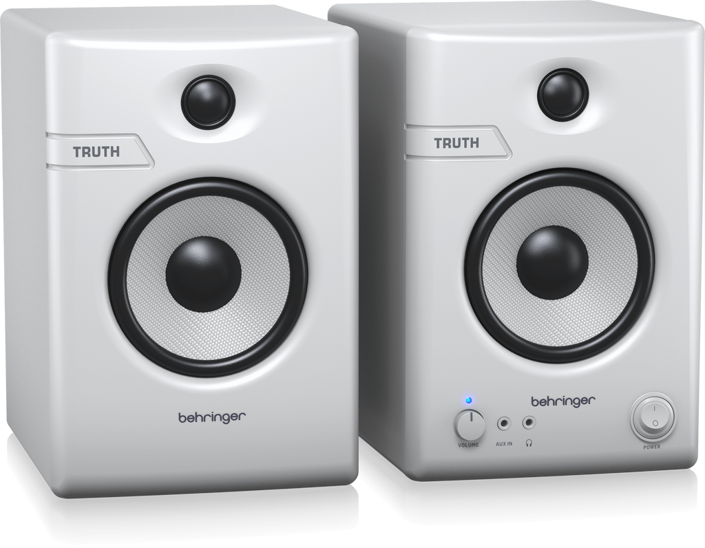 Pair of Behringer Truth 4.5 studio monitor speakers in white with Bluetooth connectivity, showing their front design and controls.
