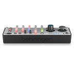 Behringer AKS Mini analog polyphonic synthesizer keyboard with control knobs and keys, compact and versatile musical instrument.