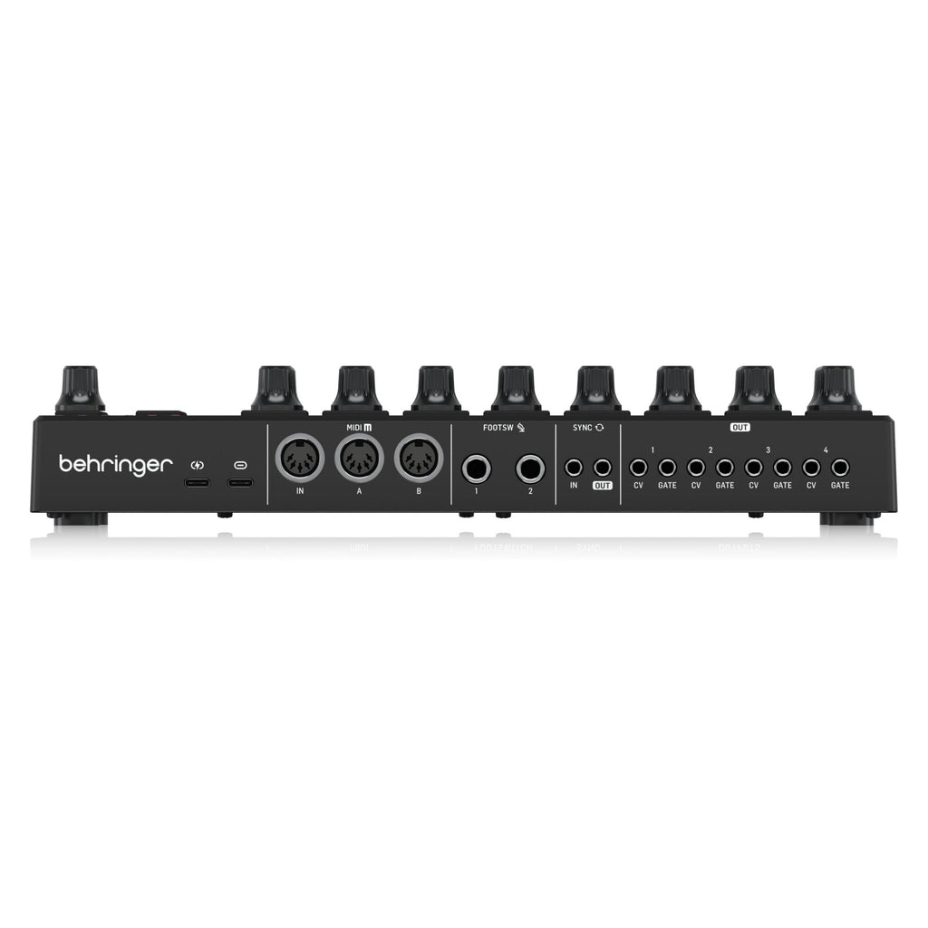 Behringer BCR32 MIDI controller with USB and MIDI ports, featuring rotary knobs and sliders for music production and control.