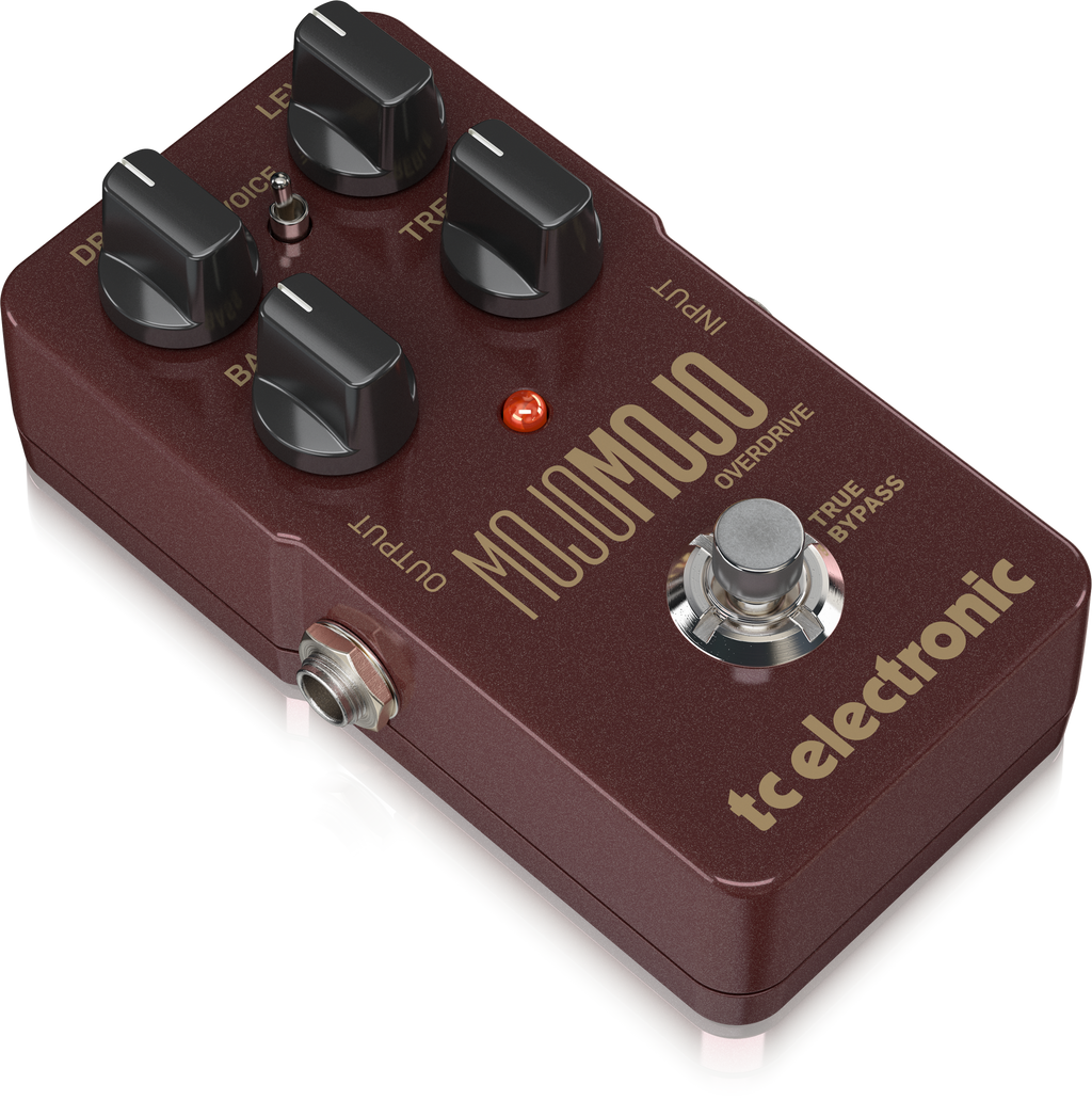 TC Electronic MojoMojo overdrive effects pedal with footswitch and control knobs on a pedalboard, used for guitar tone shaping.