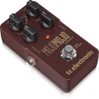 TC Electronic MojoMojo overdrive effects pedal with footswitch and control knobs on a pedalboard, used for guitar tone shaping.