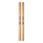 Vater VHTKBW Tai Ko Bachi drumsticks with wooden handles for percussion playing, shown resting on a drum kit.