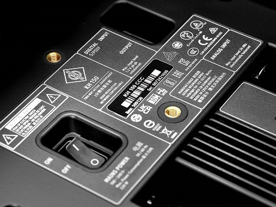 Neumann KH150 6.5-inch 2-way studio monitor speaker with DSP in black, shown from a side angle.