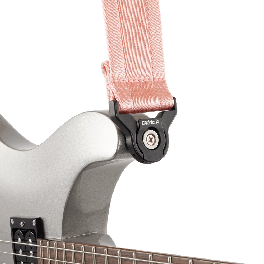 D'Addario Auto Lock guitar strap in new rose color, adjustable with secure locking mechanism for electric or acoustic guitars.