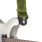 D'Addario Auto Lock Moss Green guitar strap with adjustable length and secure locking mechanism for acoustic and electric guitars.